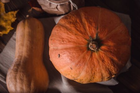 Pumpkin on a wooden table. The view from the topの写真素材