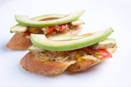 Bruschetta crostini with chopped vegetables and avocado. Italian foodの写真素材