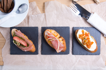 Bruschetta crostini set on a slate plate. The composition of the Italian food.の写真素材