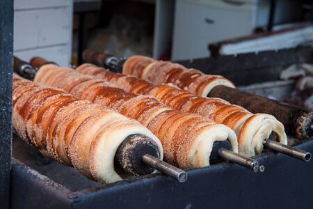 Trdelnik. trodlo dusted with sugar. baked goods dough is wound on a metal or wooden skewer in a spiral.の写真素材