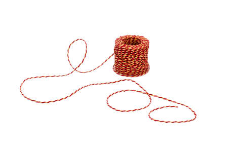 Red and yellow twin isolated on white background. cute and classic twine features a colors of red and yellow twisted togetherの写真素材