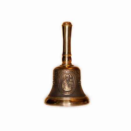 bronze Bell with the image of the face of the Blessed Virgin Mary isolated on white background. bronze with black.の写真素材