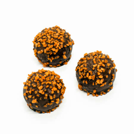 chocolate orange petit fours cakes isolated on white background. chocolate candies.の写真素材