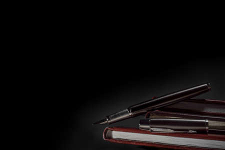 Fountain pen and old booksの写真素材