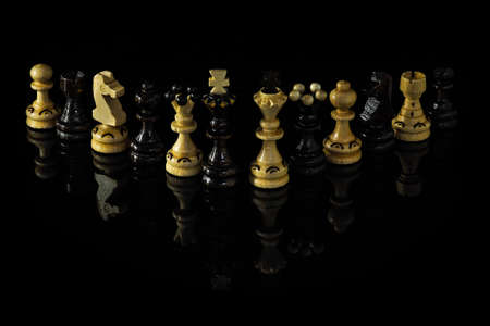 Chess figures isolated on black backgroundの写真素材