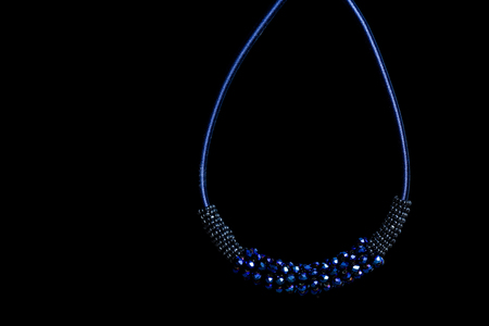 Jewelry blue pendant with crystals on black backgroundの写真素材