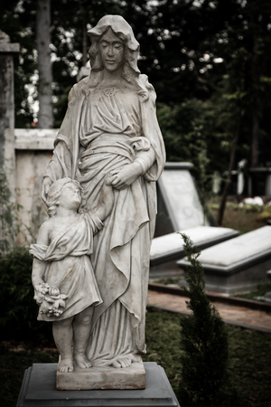 Statue with tombstones in old cemetery Museum Prasastiのeditorial素材