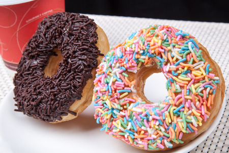 Colorful and chocolate Donut with coffeeの写真素材