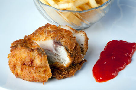 Fried Chicken with potatoes and chili sauceの写真素材