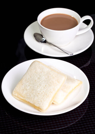 Two Breakfast bread with milk tea in verticalの写真素材