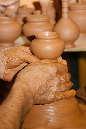 Potter making a small clay potの写真素材