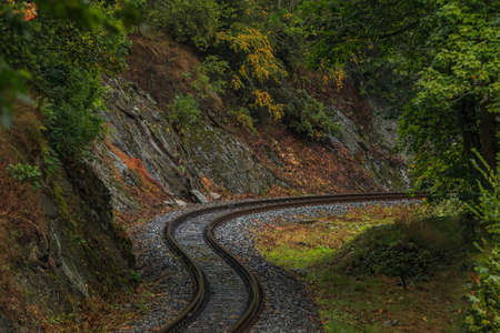 Railway line in the Harz Mountains. Narrow-gauge railway in curves in the valley in the low mountain...
