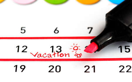 Vacation plan written on calendarの写真素材