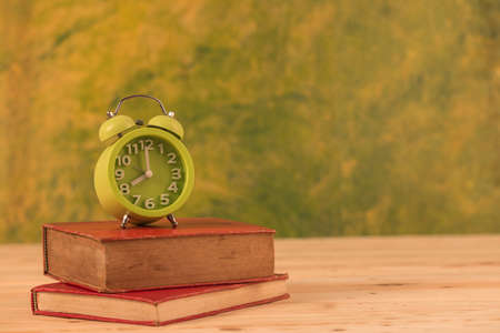 Vintage books and clockの写真素材