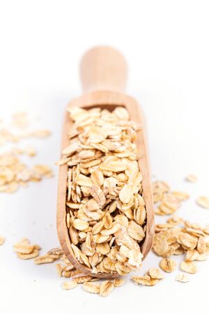 oats in wooden spoonの写真素材