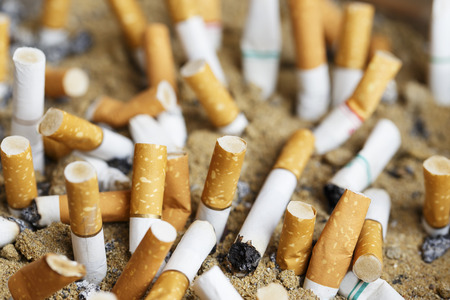 Many cigarette butts backgroundの写真素材