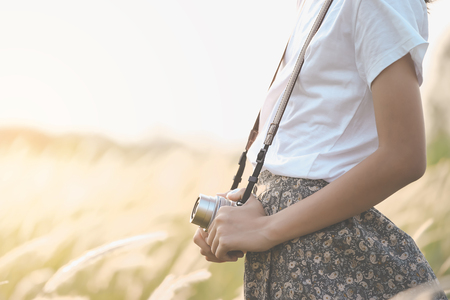 Woman hand holding cameraの写真素材