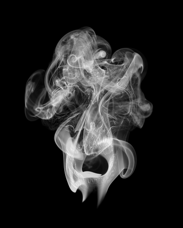 Human scull appearing in smokeの写真素材