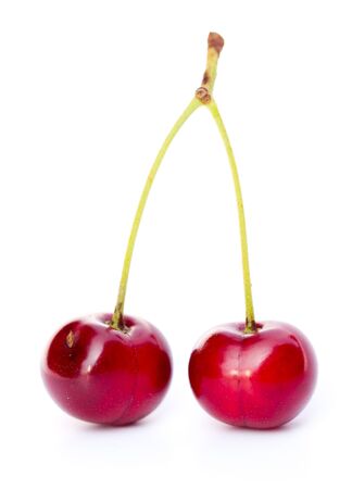A pair of isolated dark red cherriesの写真素材