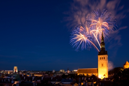 Fireworks in the Old Town of Tallinn, the capital of Estonia, Europe  In front of fireworks there is a church Saint Nicolas の写真素材