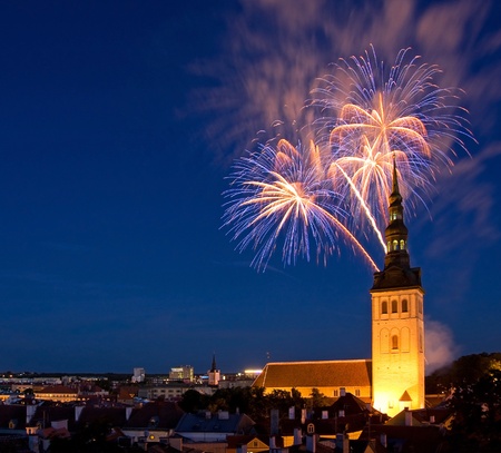 Fireworks in the Old Town of Tallinn, the capital of Estonia, Europe  In front of fireworks there is a church Saint Nicolas の写真素材