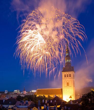 Fireworks in the Old Town of Tallinn, the capital of Estonia, Europe  In front of fireworks there is a church Saint Nicolas の写真素材