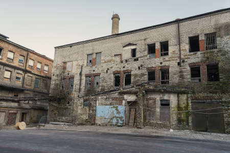 Old abandoned industrial buildings with broken windows の写真素材
