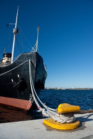Ship fore with ropes attached to quayの写真素材