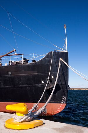 Ship fore with ropes attached to quayの写真素材