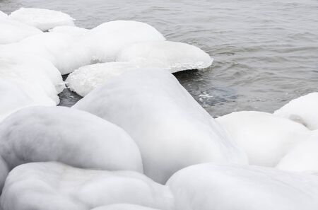 Big rocks covered with white ice