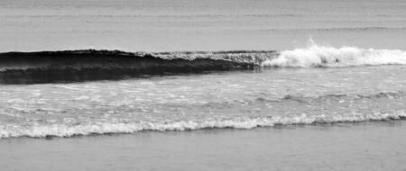 Grayscale picture of water waves in sea  の写真素材