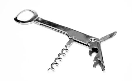 Chromed metal bottle opener on white backgroundの写真素材