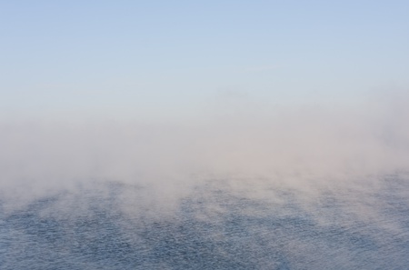 Blueish nature background of vaporing or misty seaの写真素材