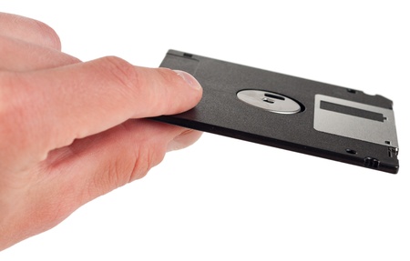 Floppy disk between fingersの写真素材
