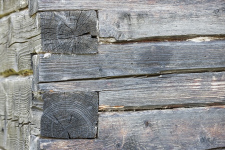 Closeup of an old timber wall made of large tree trunksの写真素材