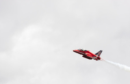 Tallinn, Estonia - June 23, 2014  Red Arrow aerobatic flight show with red fighter jets in Tallinn, Estonia on June 23, 2014のeditorial素材
