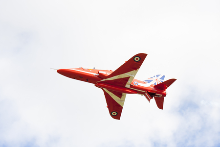 Tallinn, Estonia - June 23, 2014  Red Arrow aerobatic flight show with red fighter jets in Tallinn, Estonia on June 23, 2014のeditorial素材
