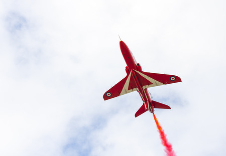 Tallinn, Estonia - June 23, 2014  Red Arrow aerobatic flight show with red fighter jets in Tallinn, Estonia on June 23, 2014のeditorial素材