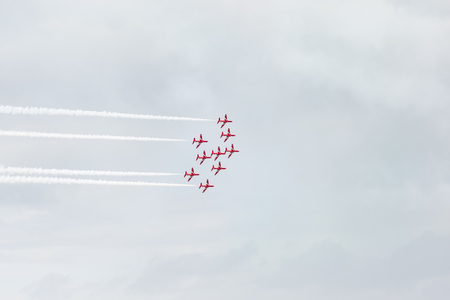Tallinn, Estonia - June 23, 2014  Red Arrow aerobatic flight show with red fighter jets in Tallinn, Estonia on June 23, 2014のeditorial素材