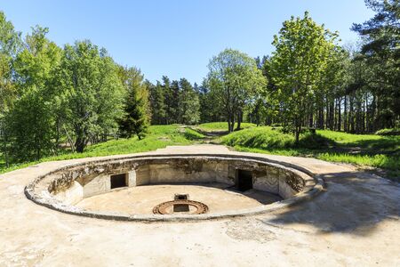 Ancient cannon platform made of concrete in forestの写真素材