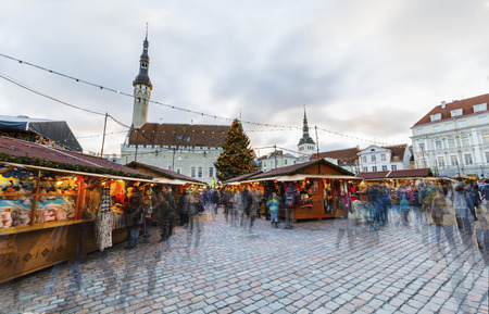 TALLINN, ESTONIA - DECEMBER 24, 2017: Tourists at Christmas market in Tallinn old town in Estonia on December 24, 2017のeditorial素材