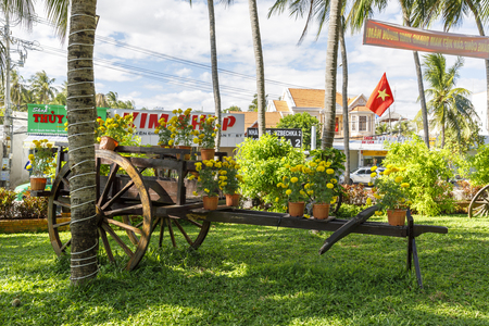 NAM TIEN, VIETNAM - FEBRUARY 18, 2018: Flowers on an old wooden horse caricature in Nam Tien, Vietnamのeditorial素材