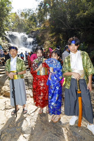DA LAT, VIETNAM - FEBRUARY 20, 2018: Children in colorful folk costumes at Datalna waterfall in Da Lat, Vietnamのeditorial素材