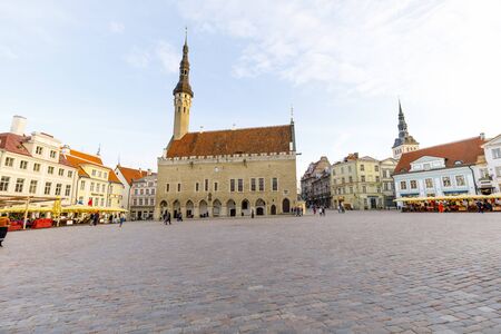 TALLINN, ESTONIA - APRIL 22, 2019: Few people walk on large town hall square in the old town of Tallinn, Estonia in April 2019のeditorial素材
