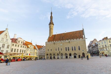 TALLINN, ESTONIA - APRIL 22, 2019: Few people walk on large town hall square in the old town of Tallinn, Estonia in April 2019のeditorial素材