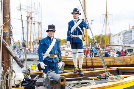 HELSINKI, FINLAND - OCTOBER 12, 2019: Sailor in ancient uniform stand on sailing ship at south harbor in Helsinki, Finland on October 12, 2019 when Traditional Sailing Day is celebrated in the countryのeditorial素材