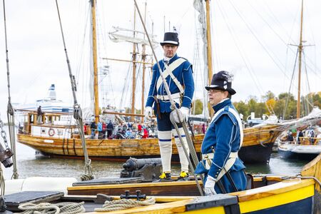 HELSINKI, FINLAND - OCTOBER 12, 2019: Sailor in ancient uniform stand on sailing ship at south harbor in Helsinki, Finland on October 12, 2019 when Traditional Sailing Day is celebrated in the countryのeditorial素材