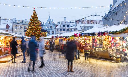 TALLINN, ESTONIA - DECEMBER 22, 2018: People visit christmas market in the old town of Tallinn, capital of Estonia on December 22, 2018のeditorial素材