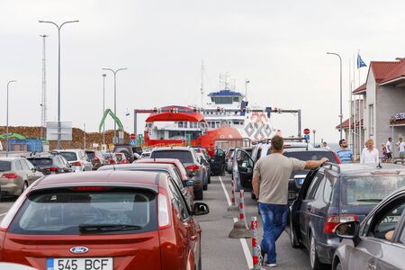 HIIUMAA, ESTNOIA - JULY 29, 2018: Vehicles in long barge queue in Heltermaa port in Hiiumaa, Estonia in July 2018のeditorial素材