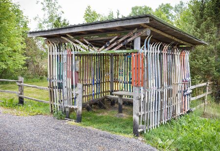 HIIUMAA, ESTONIA - JULY 29, 2018: Resting cabin decorated with old skies in Hiiumaa, Estonia in July 2018のeditorial素材